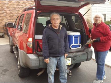 volunteers delivering meals for meals in motion